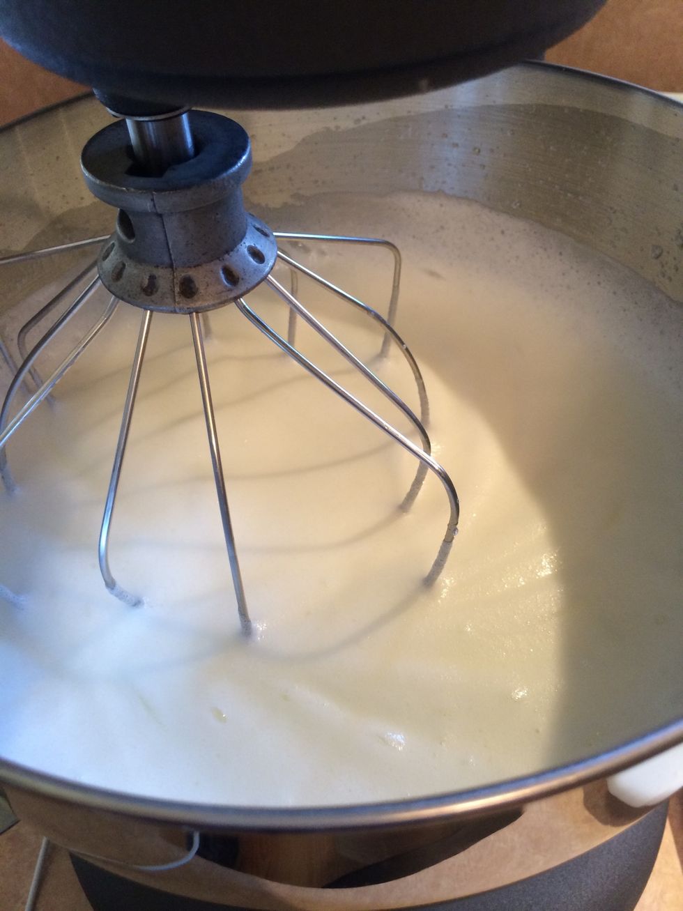 Whip egg whites until light and foamy.