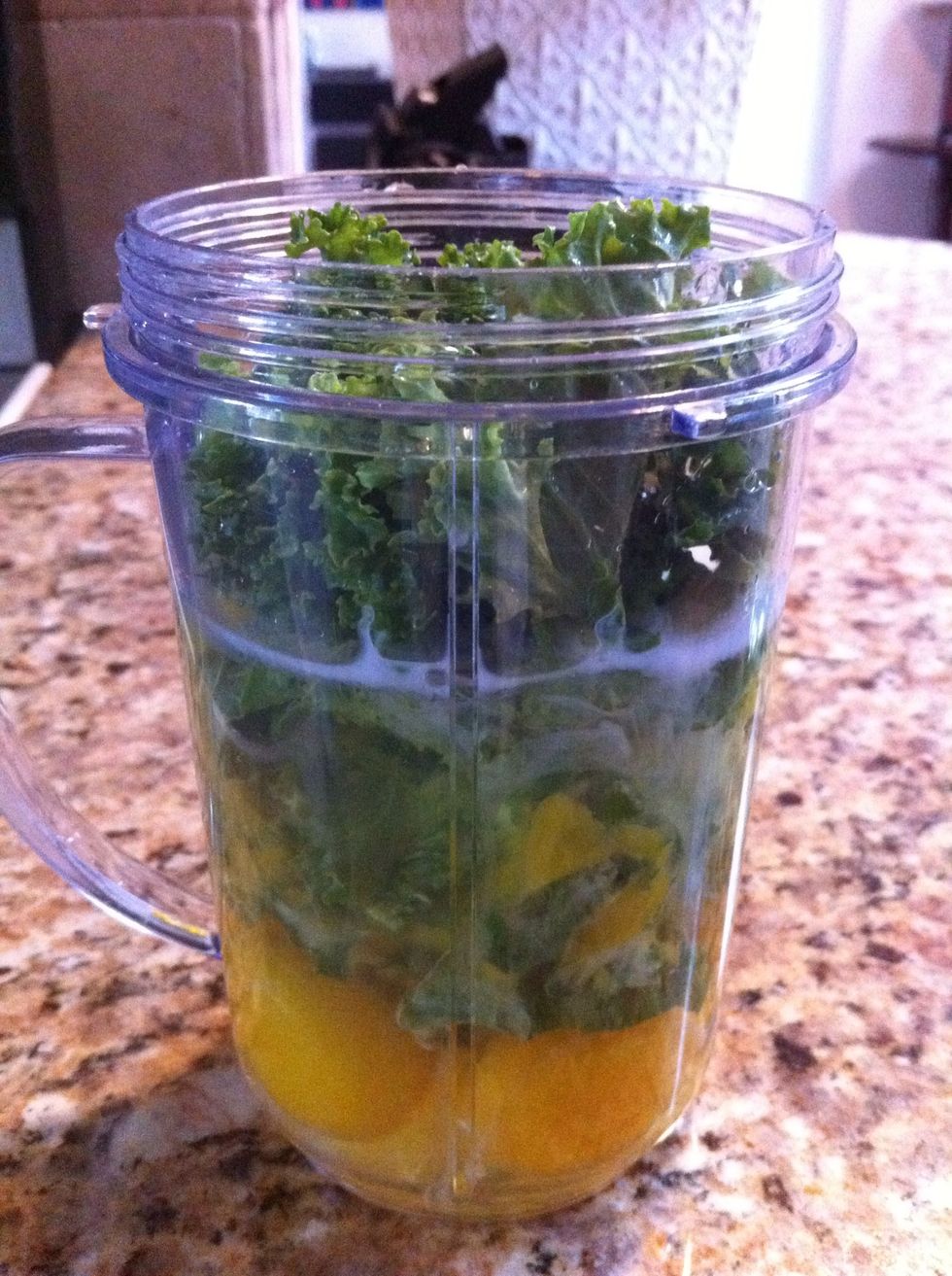 Whip eggs, milk and kale or spinach in a blender until well blended. Spray the pan with cooking spray and add eggs. Cook stirring frequently until eggs start to set - about 4 to 5 minutes.