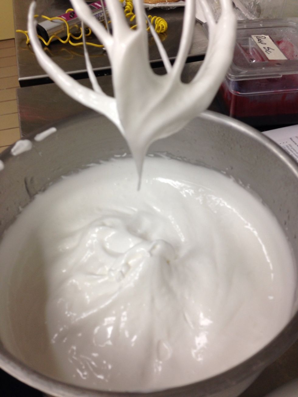 Whip till soft peaks form and the meringue is glossy.