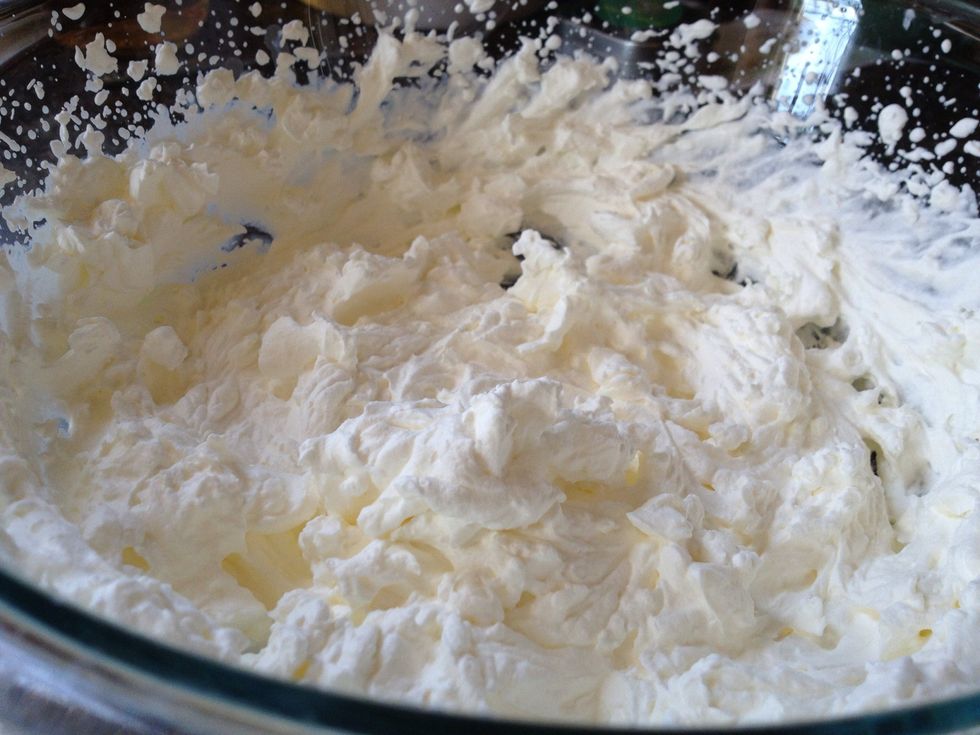 Whip until stiff peaks form. Don't overwhip or you'll end up with butter.