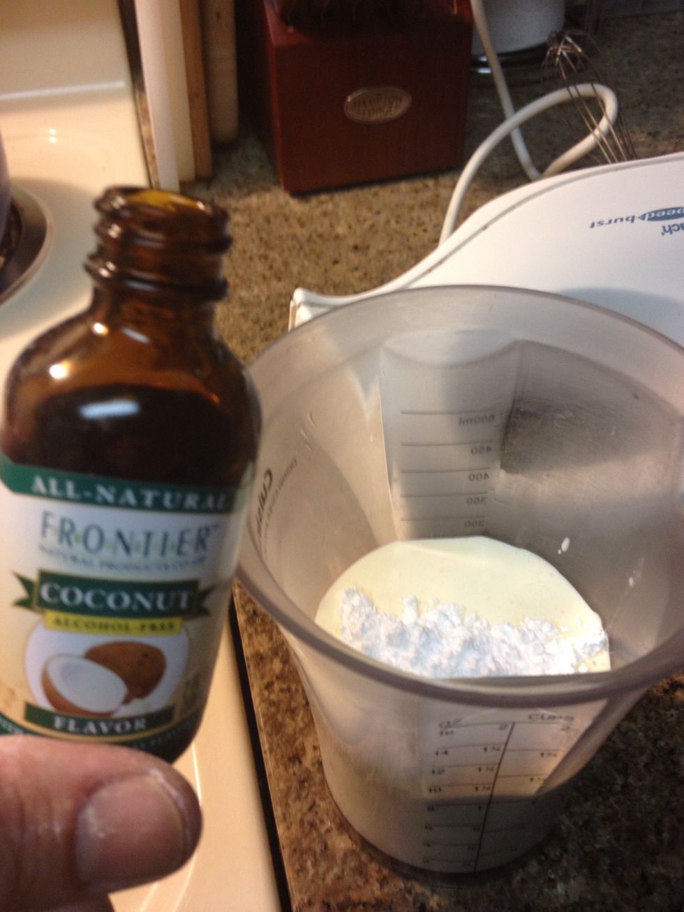 Whip up some heavy cream and before it fully thickens add 3/4 tbsp coconut extract and 1 tbsp powdered sugar.