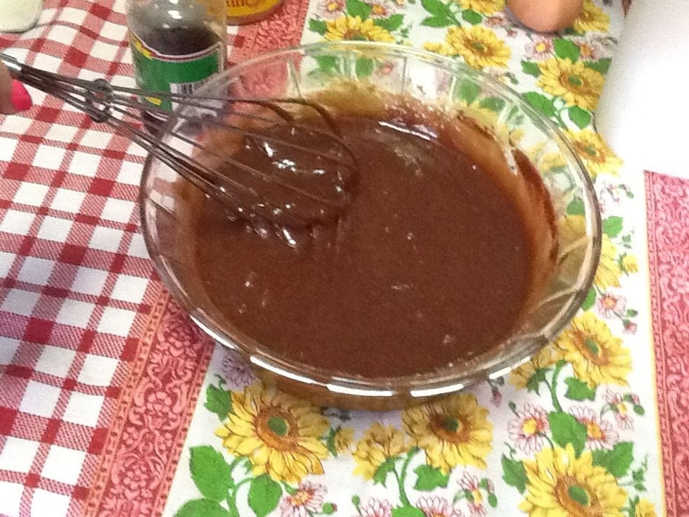Whisk 1 cup of the sugar into the chocolate mixture. Then add 2 of the eggs, before whisking in the vanilla extract.