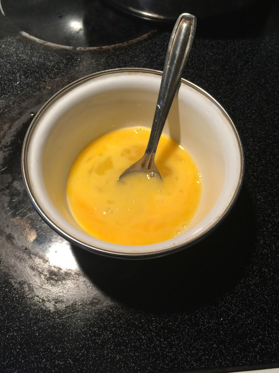 Whisk 2 eggs in a bowl