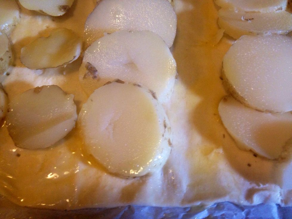 Whisk an egg and then cover the edges with it. If you haven't covered the whole puff pastry with potatoes you can cover remaining pastry parts with the egg.