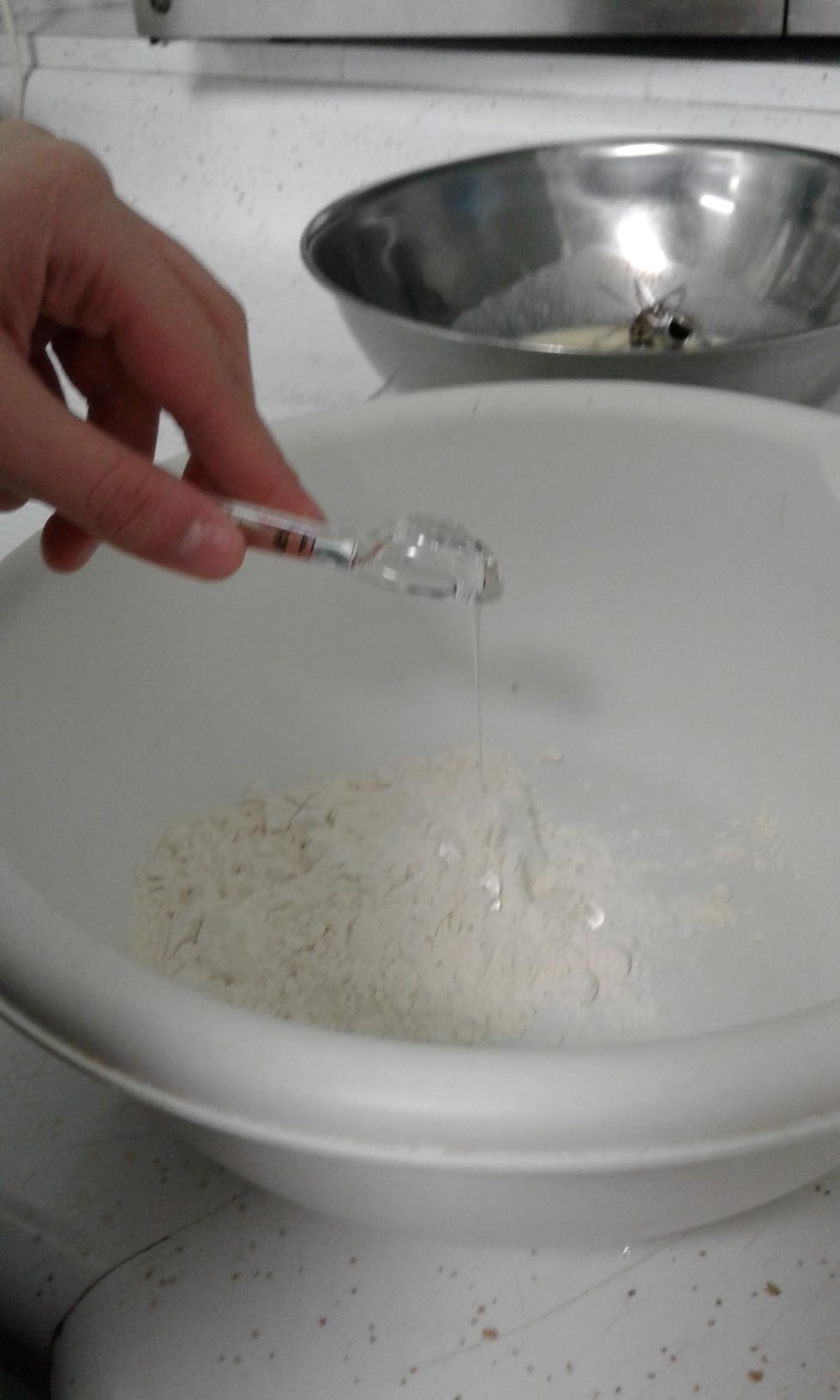 whisk buttermilk, egg, and a half cup of water in a medium bowl. whisk flour, cornstarch, 1 tablespoon salt and 1 tablespoon pepper into a baking sheet.