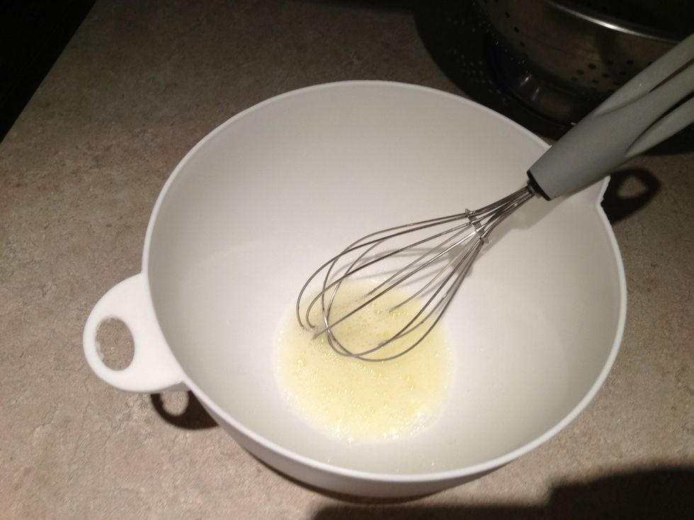 Whisk egg white and water until frothy.