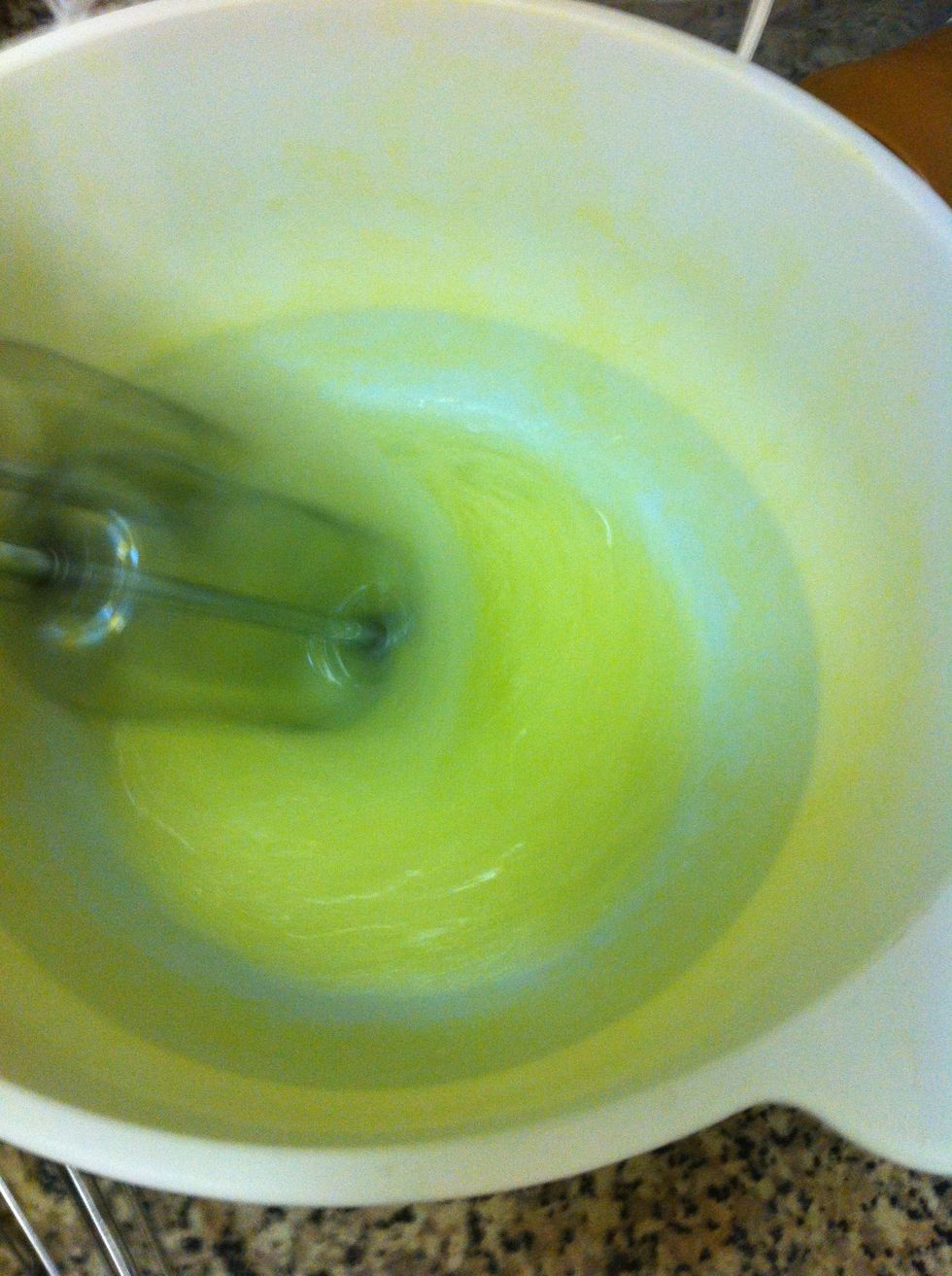 Whisk egg whites using an electric mixer to make the meringue. (don't mind my yellow stained bowl, I was making yellow frosting previously).