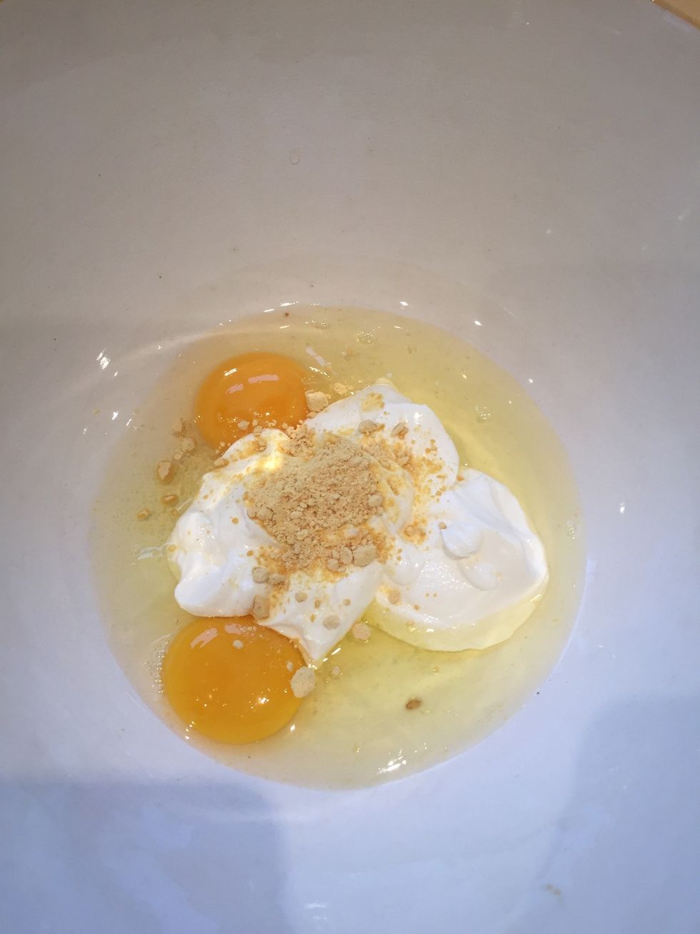 Whisk egg yolks, yogurt and mustard powder together until smooth
