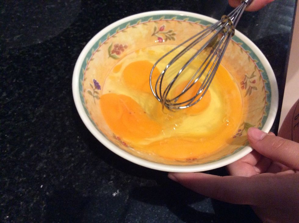 Whisk eggs together