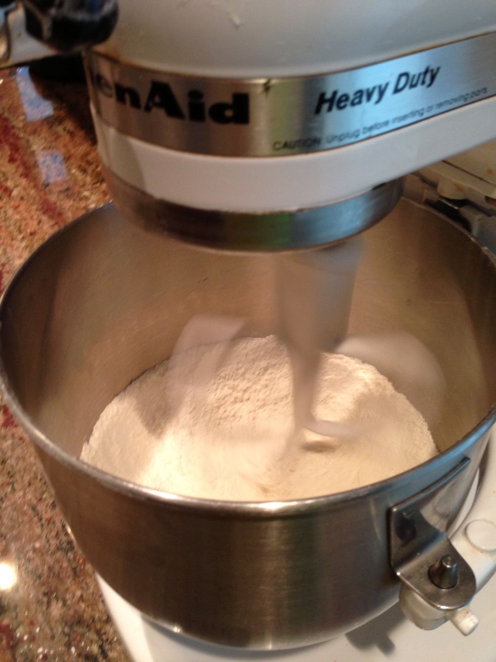 Whisk flour, salt, and baking powder together. You might want to use a different bowl than the electric mixer. You're going to have to add them later.
