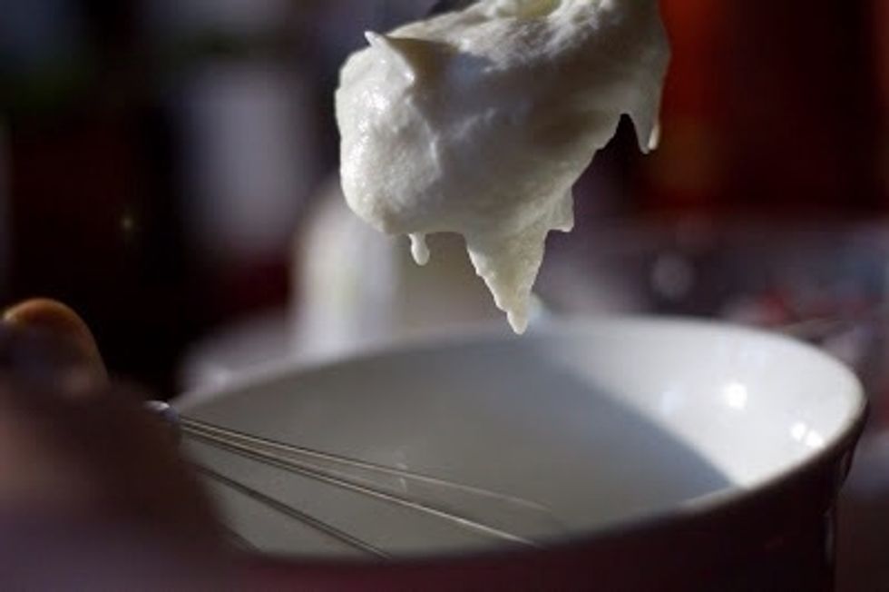 Whisk in:1 cup of plain yogurt. Put it all into the fridge to chill for about 25 minutes. Put a metal bowl to chill in the freezer.