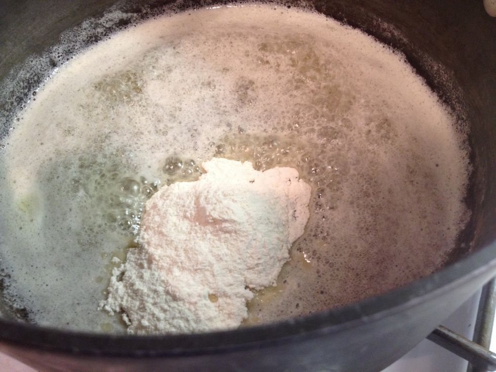 Whisk in the flour and cook for 1 minute