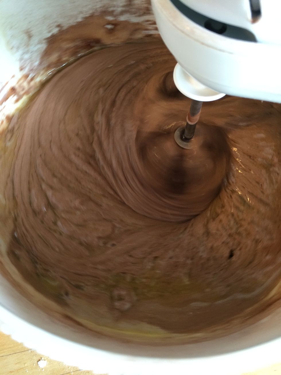 Whisk it in. It looks strange in the beginning, but be patient.