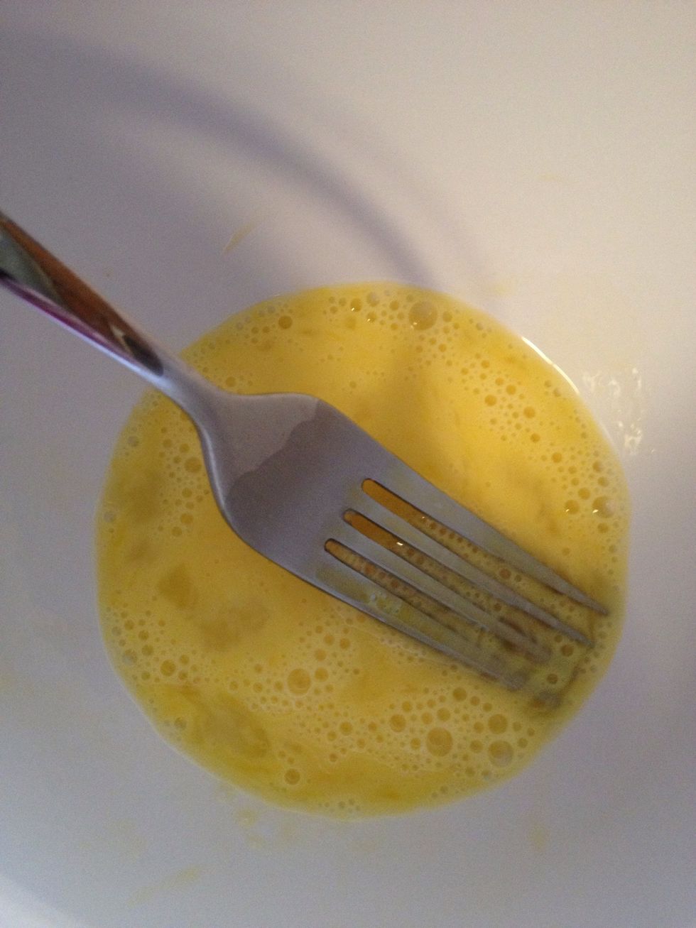 Whisk one egg. Add to crumb mixture