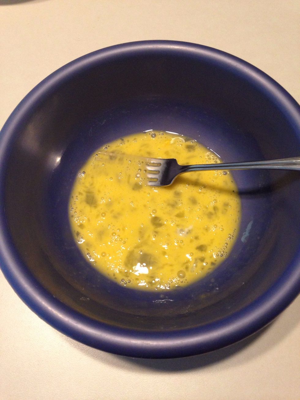Whisk one egg in a separate bowl.