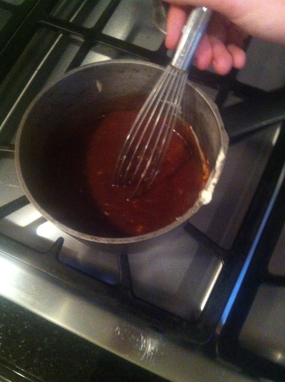 Whisk sauce ingredients together while slow cooking it on a stove