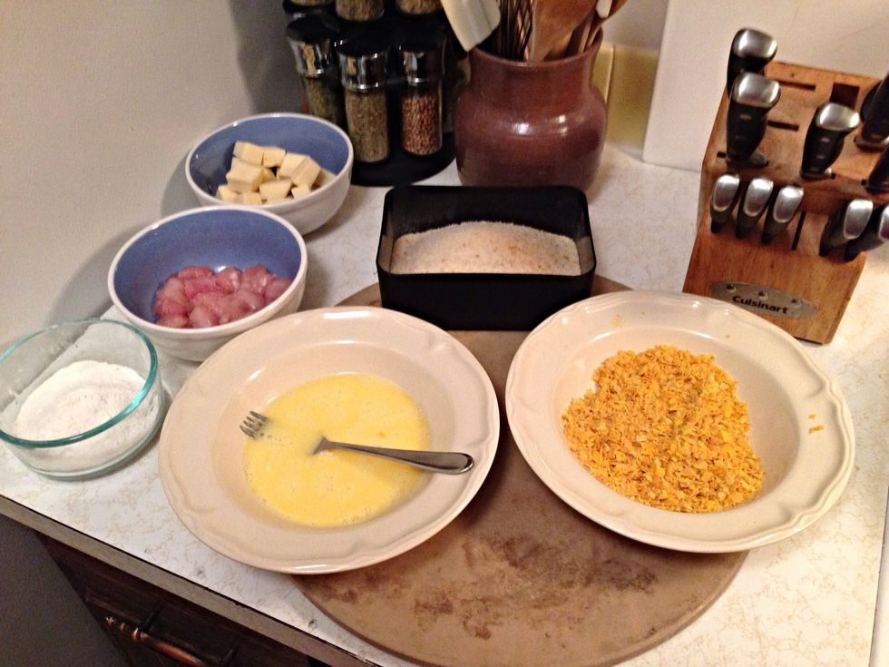 Whisk some eggs in a bowl. I will be breading the cheese in breadcrumbs and the chicken in crushed corn flakes to give it a different taste and texture.