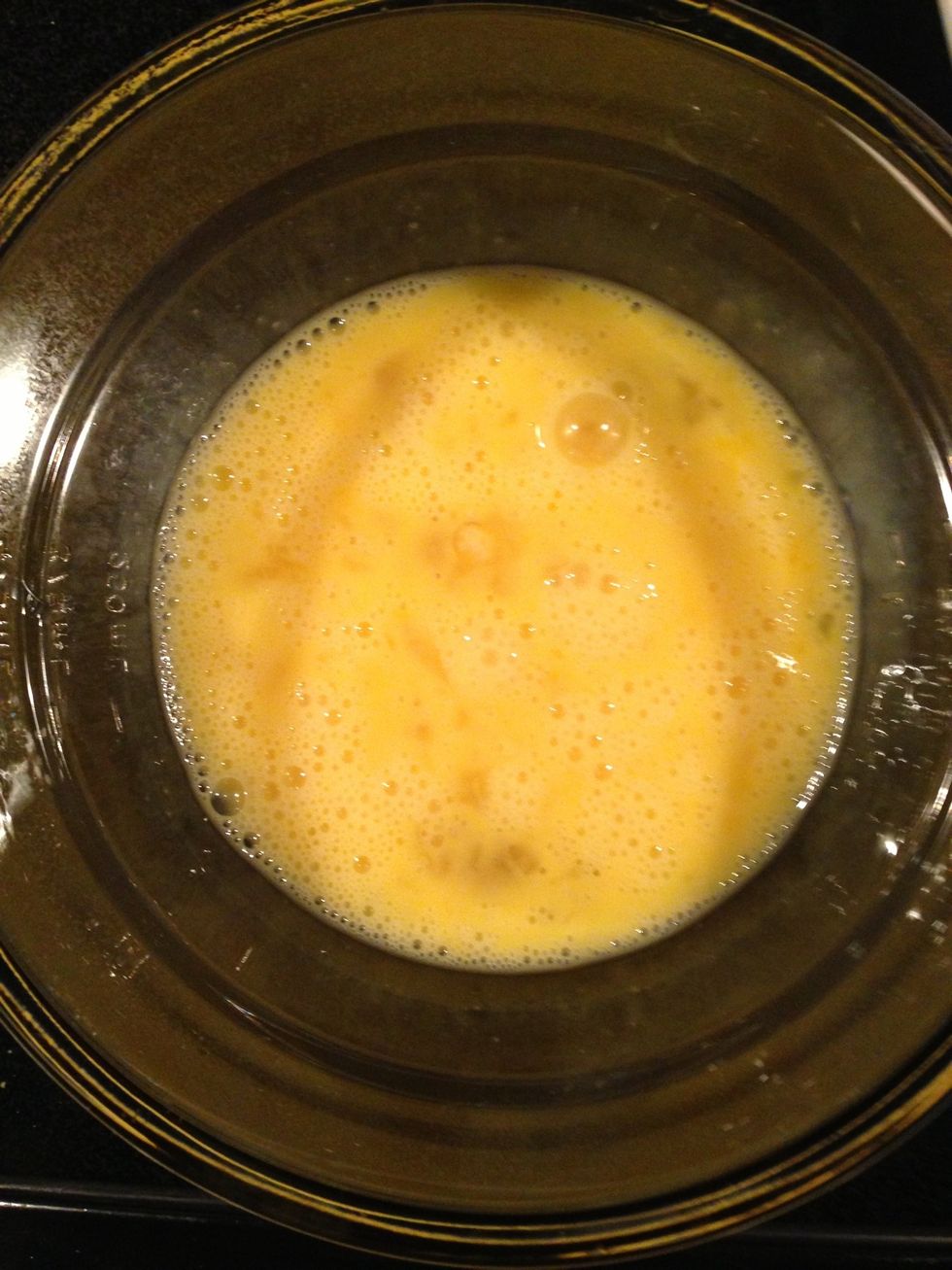 Whisk the 4 egg whites and 2 yolks together.