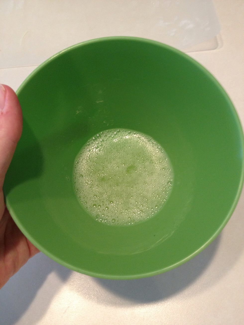 Whisk the egg white with a fork until frothy.