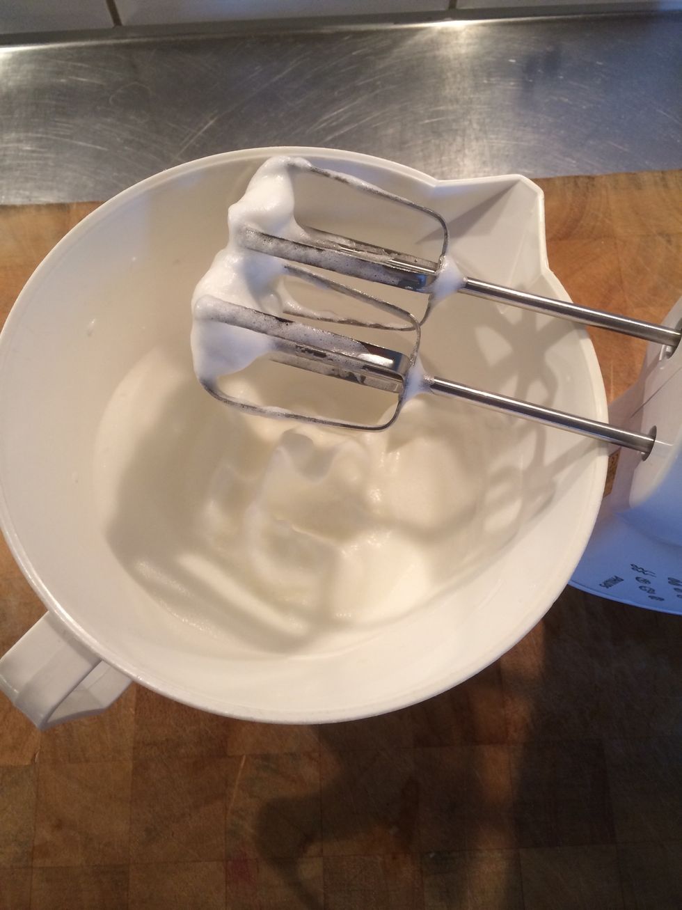 Whisk the egg whites in a bowl until they are fixed. You can turn the bowl upside down without it spilling out.