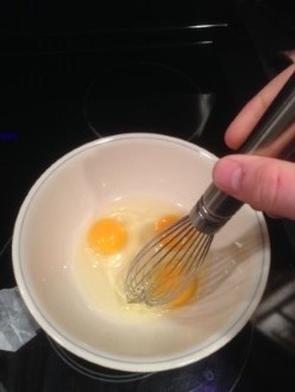 Whisk the eggs until the eggs are a solid color.
