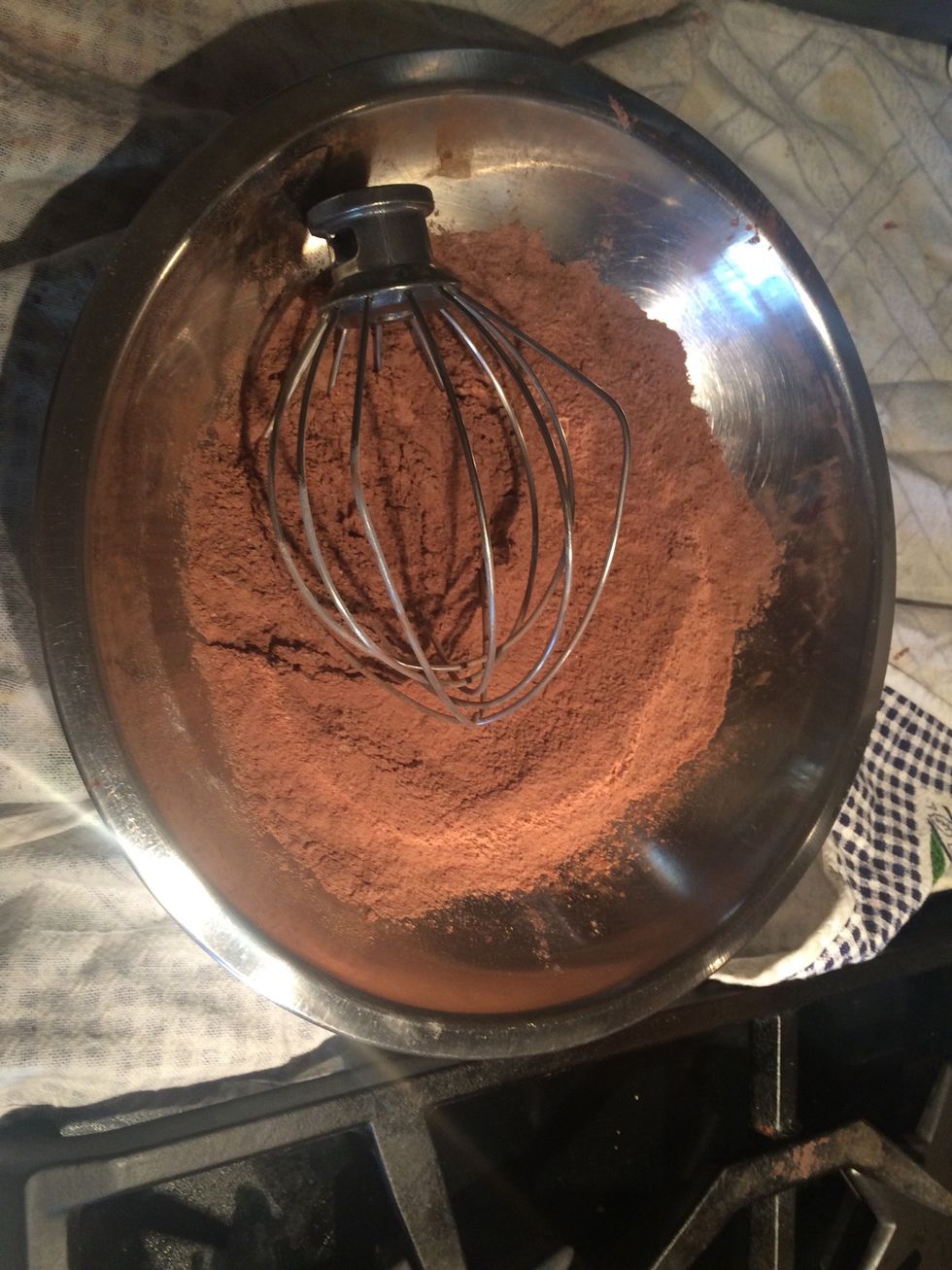 Whisk the flour, cocoa powder, salt, baking soda, and baking powder together, like so. Make sure it is thoroughly combined.