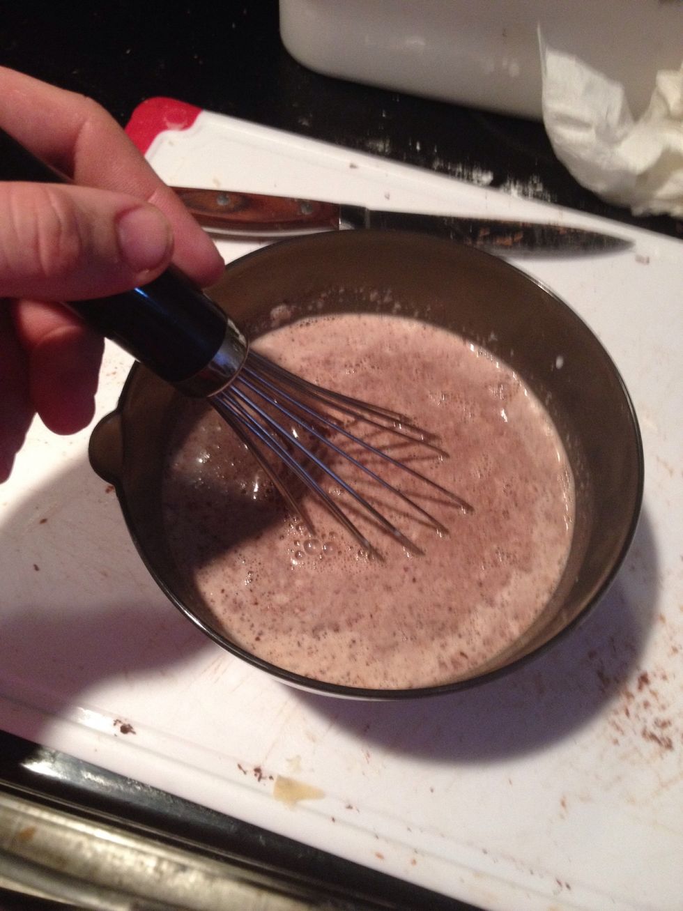 Whisk the melted chocolate and the cream together