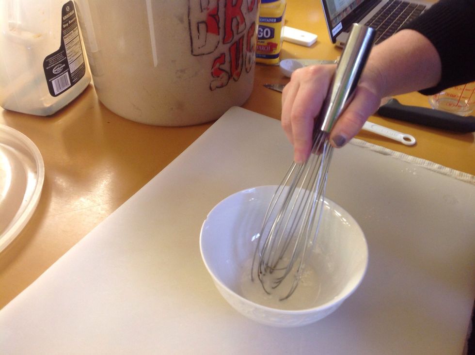 Whisk the slurry until there no clumps and it looks like milk. Reserve this mixture for later but have it ready before cooking the sauce.