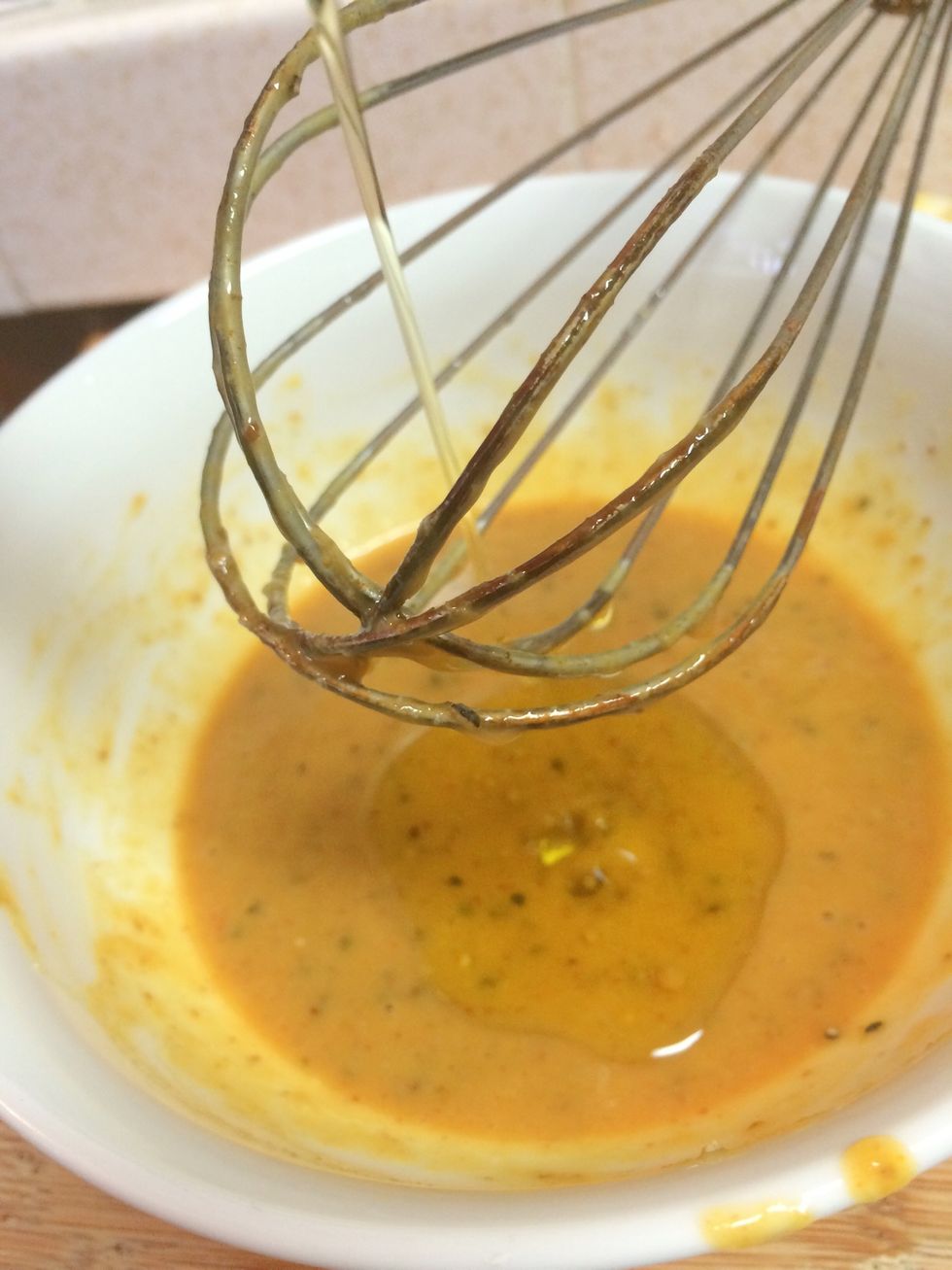 Whisk together and add 1/4 cup of olive oil until combined. Then pour over chicken and let marinate for 30 mins.