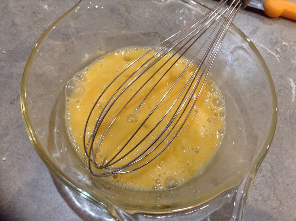 Whisk together egg and vanilla extract