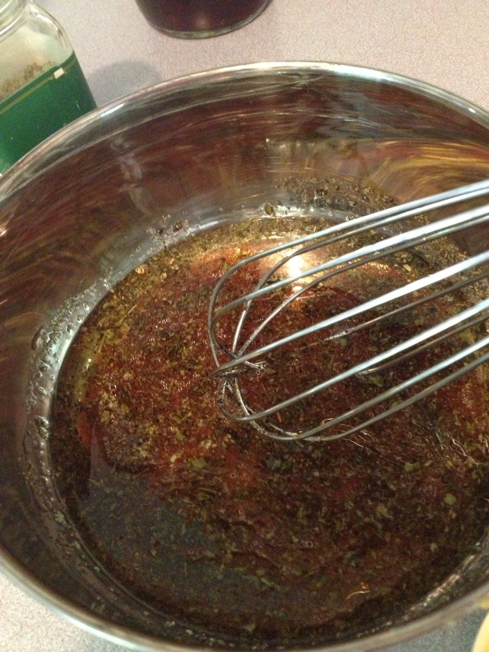 Whisk together olive oil, vinegar, oregano, onion powder, garlic powder, salt, pepper and basil in small bowl.