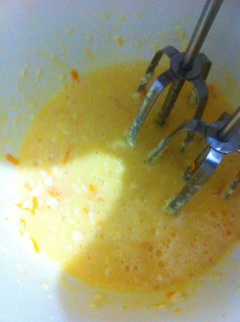 Whisk until smooth. Then Take your 1st orange and grate it to get the zest. Add it to eggs n butter