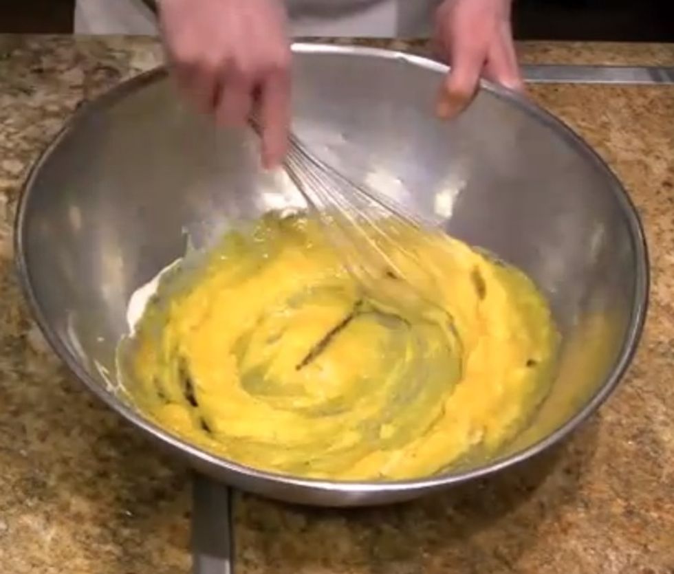 Whisk until the egg yolks look pale yellow.