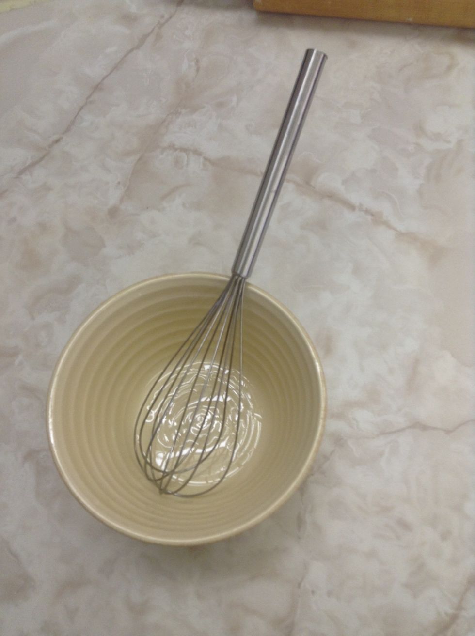 Whisk. Used to fluff up eggs (whisk them) or to mix. I can use a whisk to make eggs fluffy for a waffle recipe.