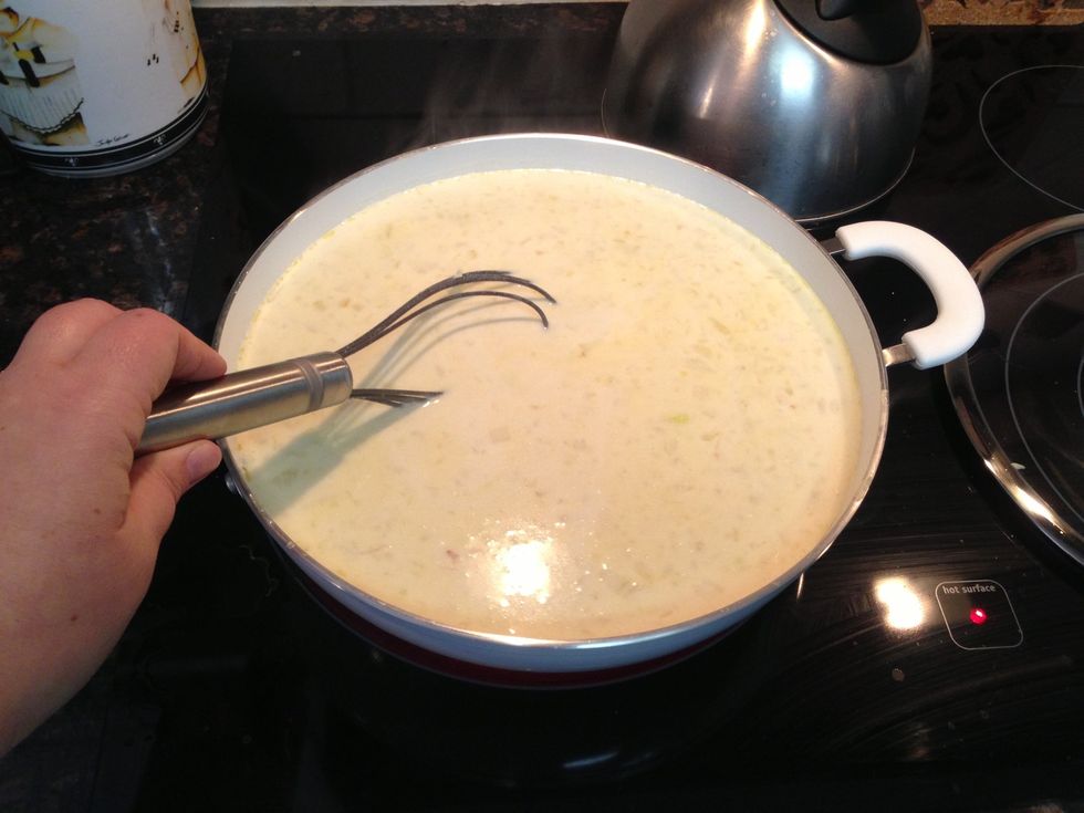 Whisk, whisk, whisk... Breaking up any lumps from the soup.