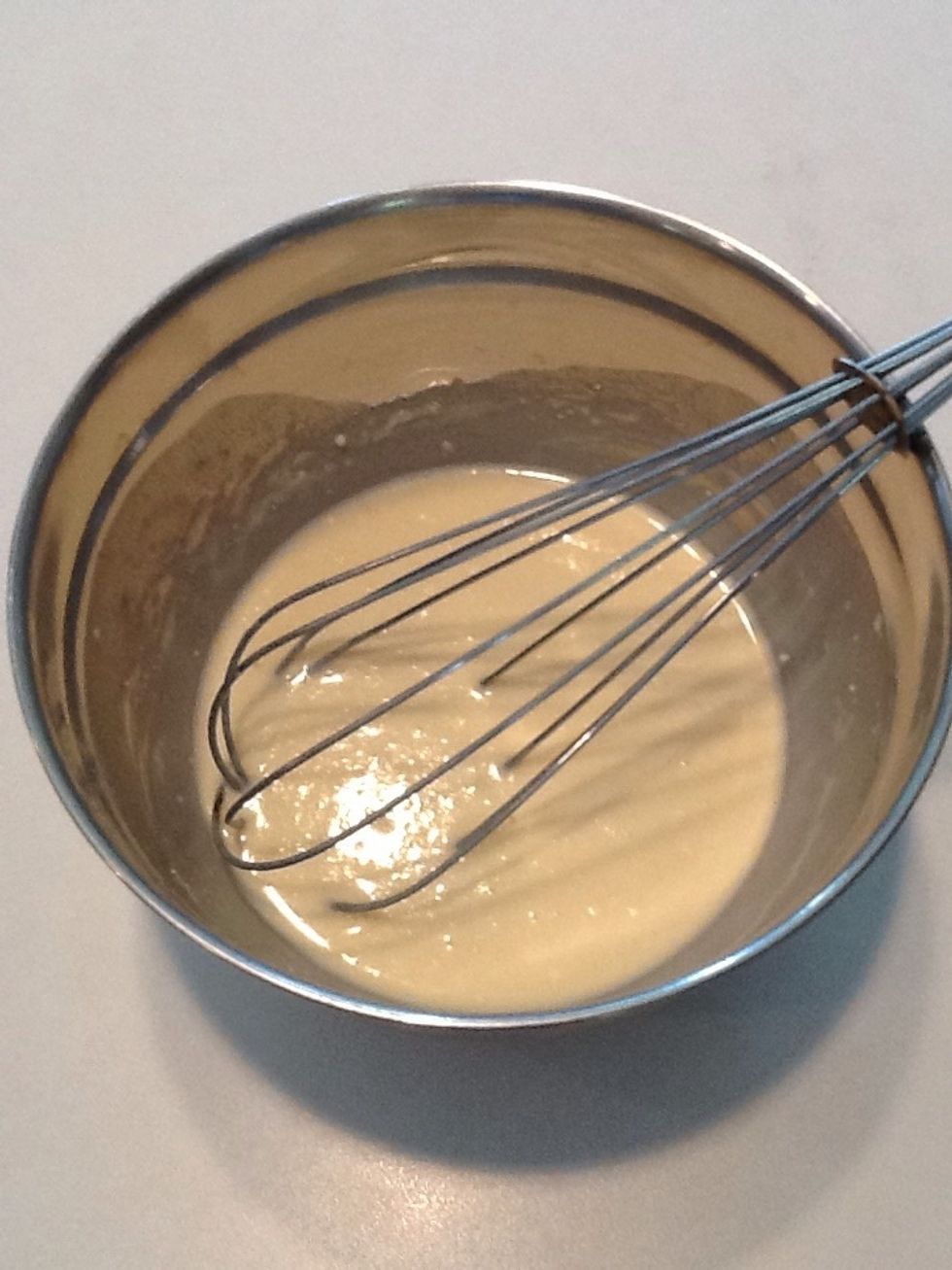 Whisk your batter again. You want it thick to cover the Oreo cookies.