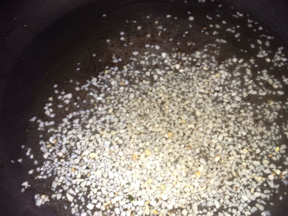 White wine and garlic in the pot