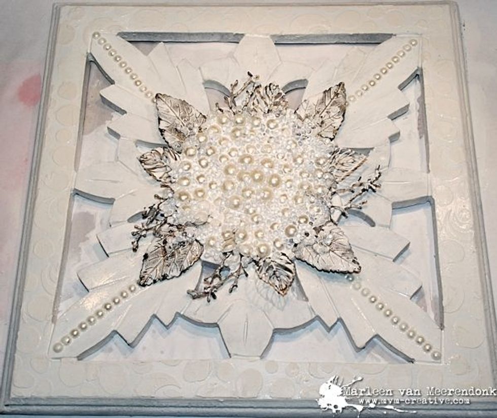 Whitewash all the embellishments with a mix from gesso with water.