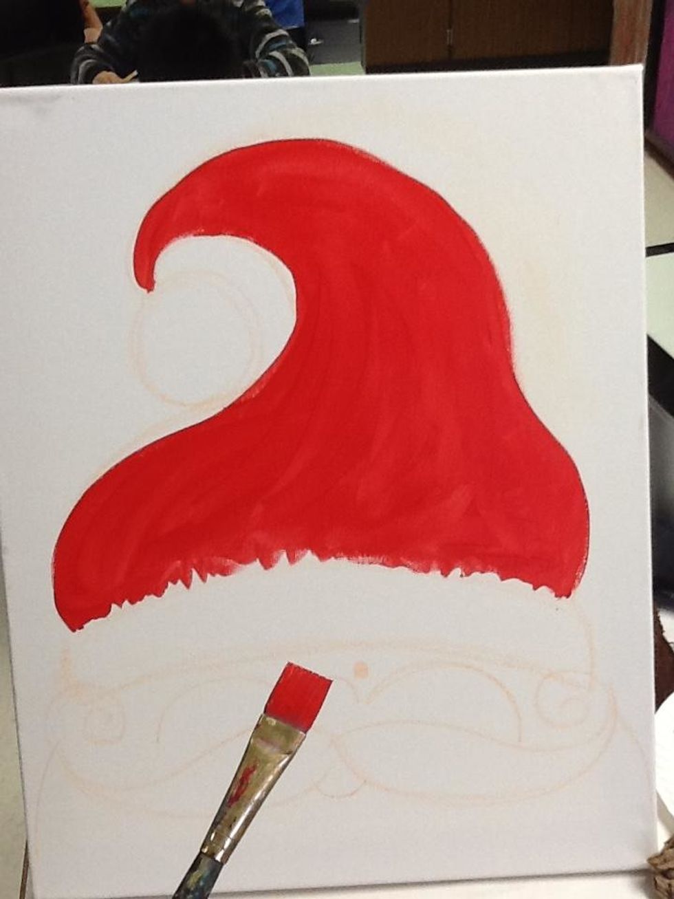 Whoa! It's time to paint red. Use a 1/2" brush to paint the cap red. Leave the bottom section rugged as the band of the cap is fuzzy.