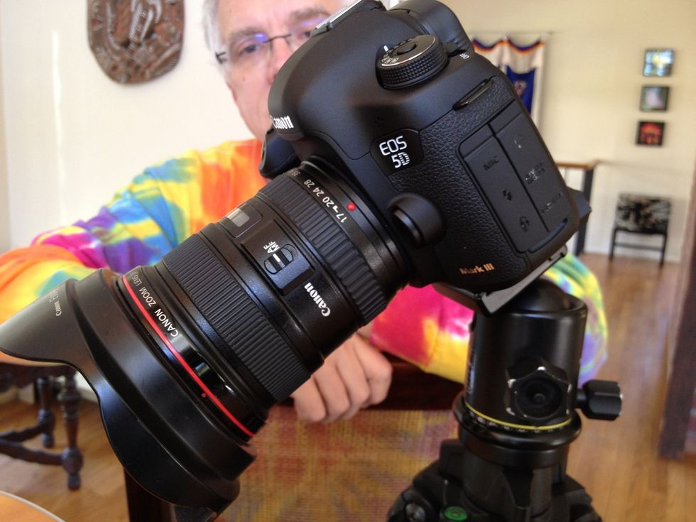 Wide Angle Lens 17-40mm zoom lens. Camera with lens mounted on tripod.