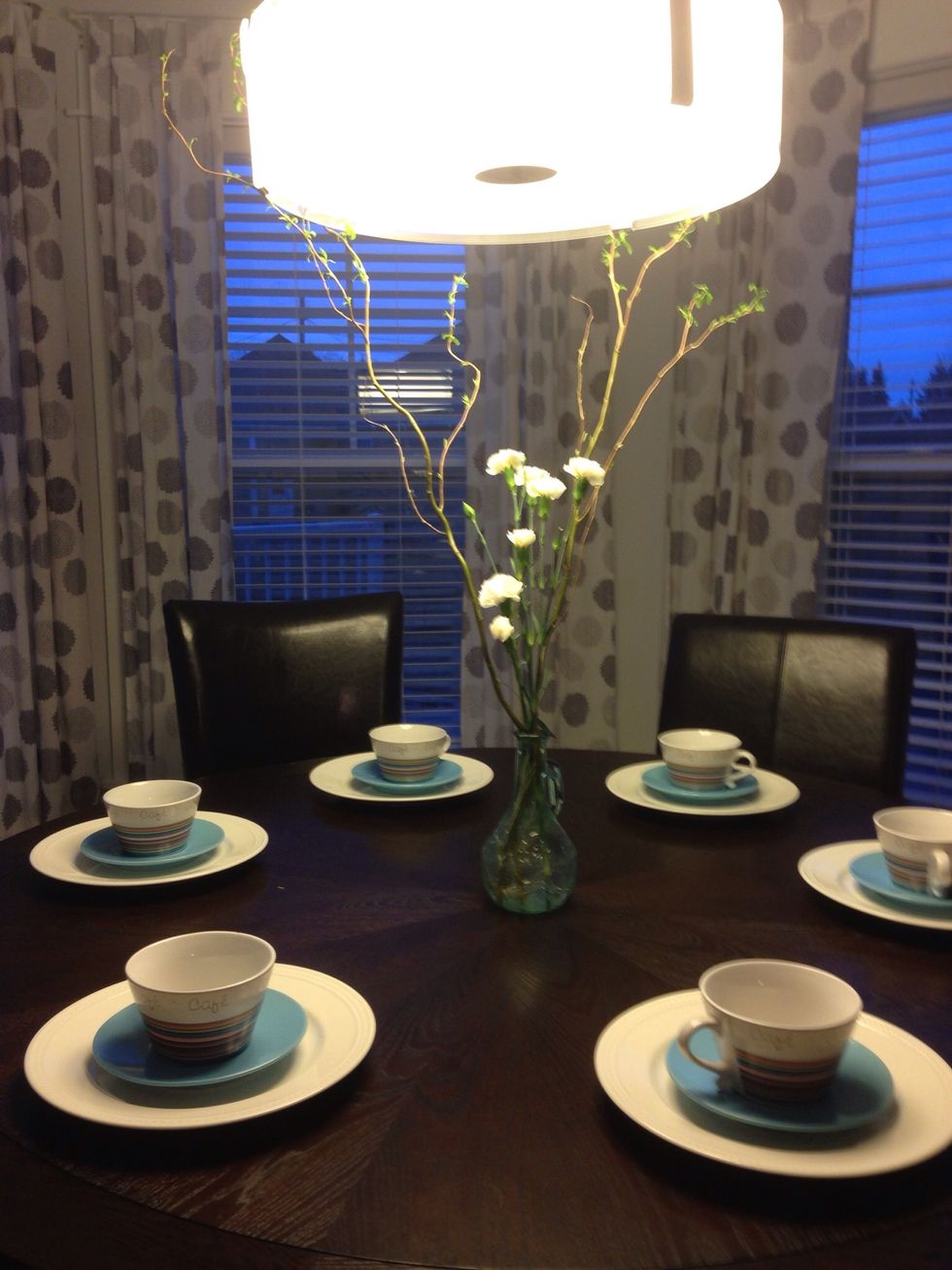 Willow branches and flowers in a whimsical vase for a centrepiece on your table makes for a springy addition! To add freshness, i've placed settings in the colours of sky blue and rainbow stripes.