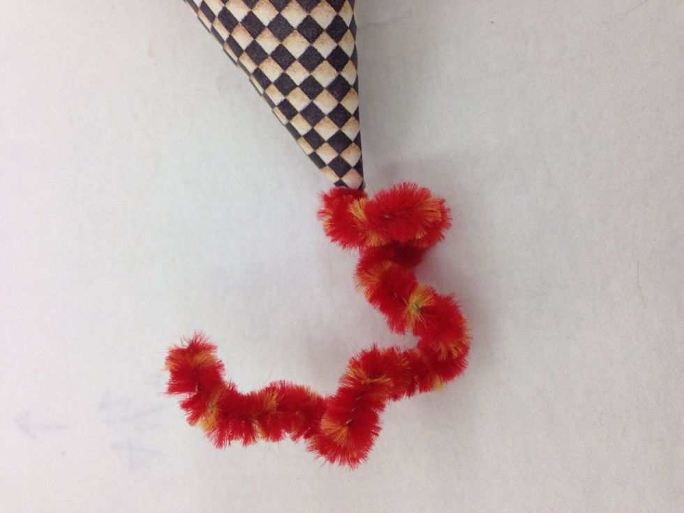 Wind a piece of pipe cleaner around a pencil or marker. You can add a flower or leaf to one end with Tacky glue. Put glue on the other end and insert into the top of the roof.