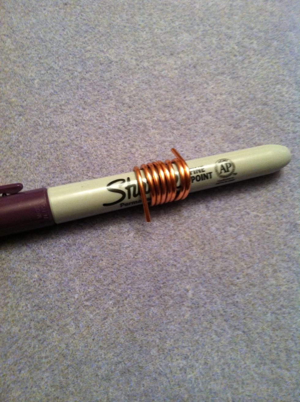 Wind wire around Sharpie. This combination gives you a larger ring.  For a smaller link, try 16 or 18 gauge wire and a smaller dowel.