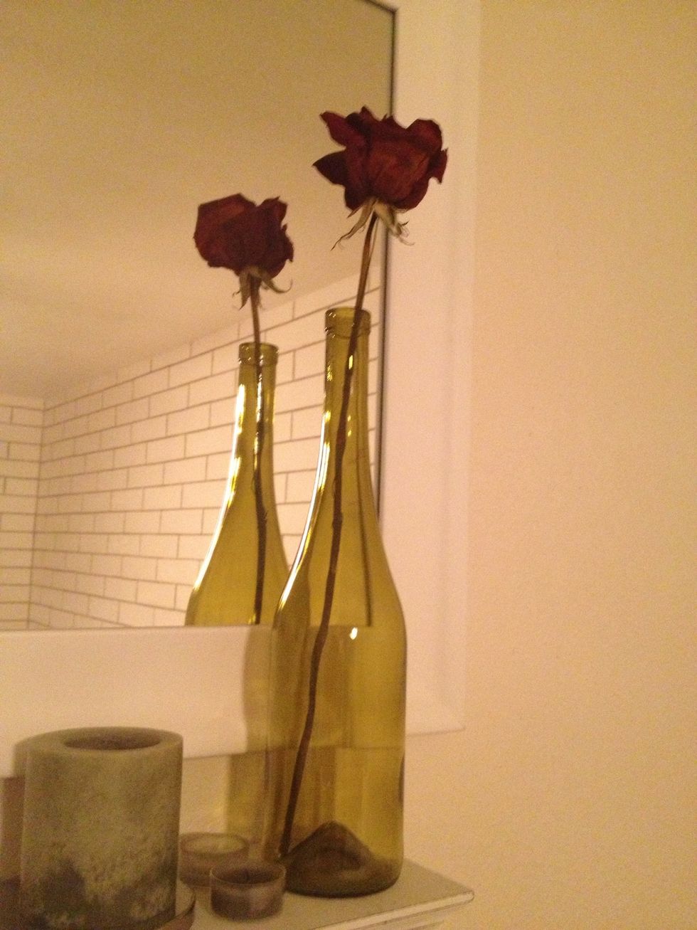 Wino? I am and I hate tossing such cool bottles! So I find ways of repurposing. I dried this rose and dropped it on a wine bottle for a simple, romantic touch. You can keep it simple or embellish.