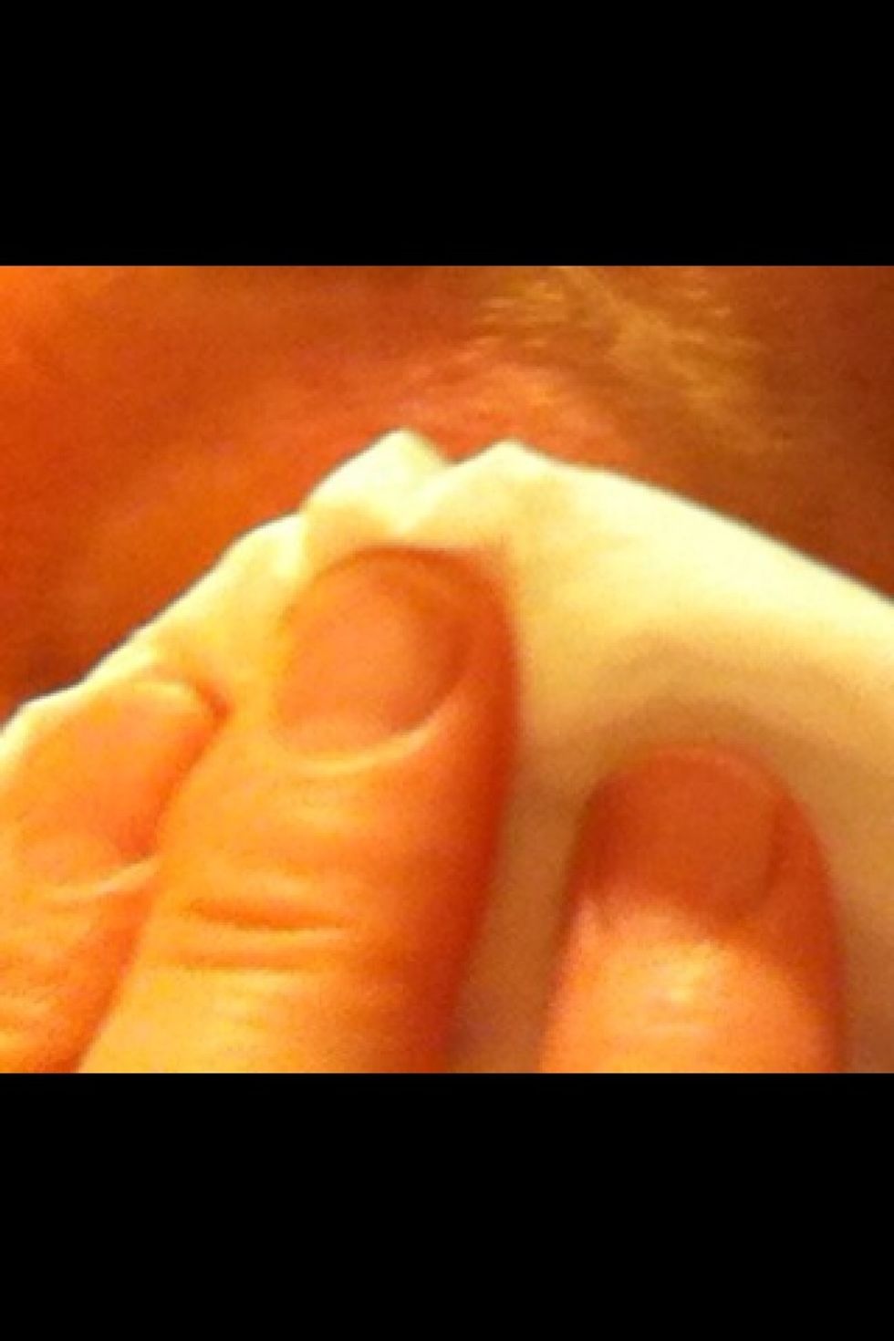 Wipe gently with Kleenex (tissue paper).