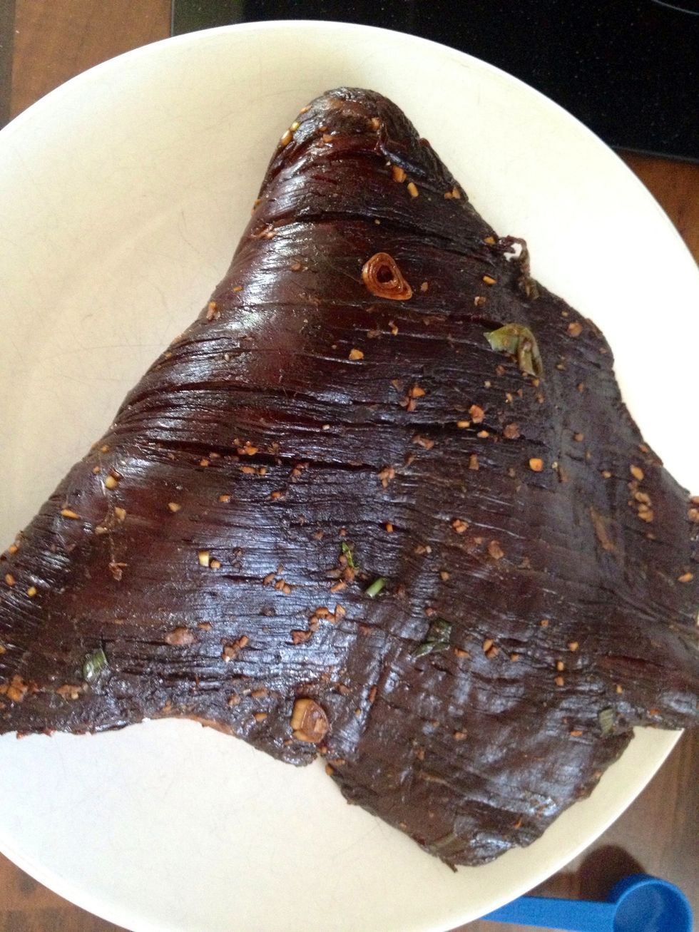 Wipe off the excess marinade. This piece of meat is folded so the actual size is the double.