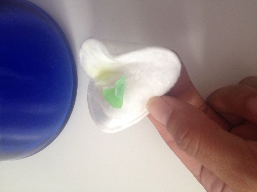 Wipe off. This luckily came right off! :) If it is a thicker goo you may have to use more and use the plastic card gently push the edges.