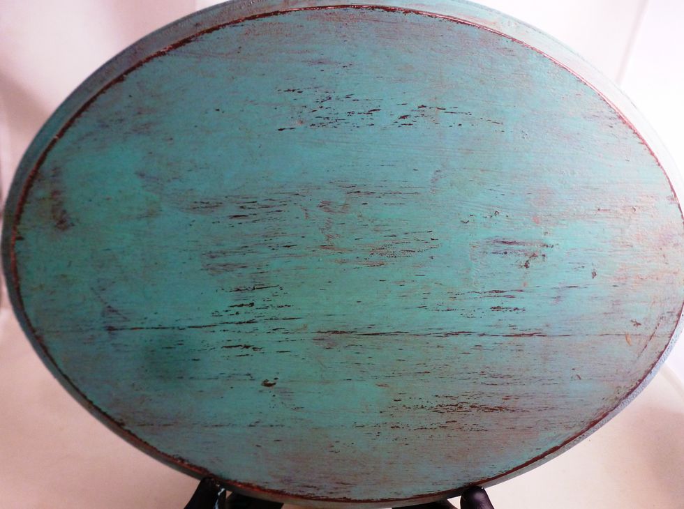 Wipe the excess off with a paper towel. It will tone down the paint and give it an aged look.