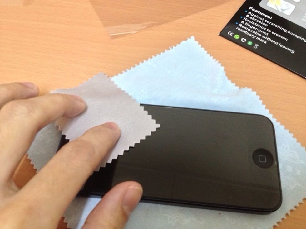 Wipe using a microfiber cloth (usually included when you buy a screen guard) on the surface gently to remove dust & dirt