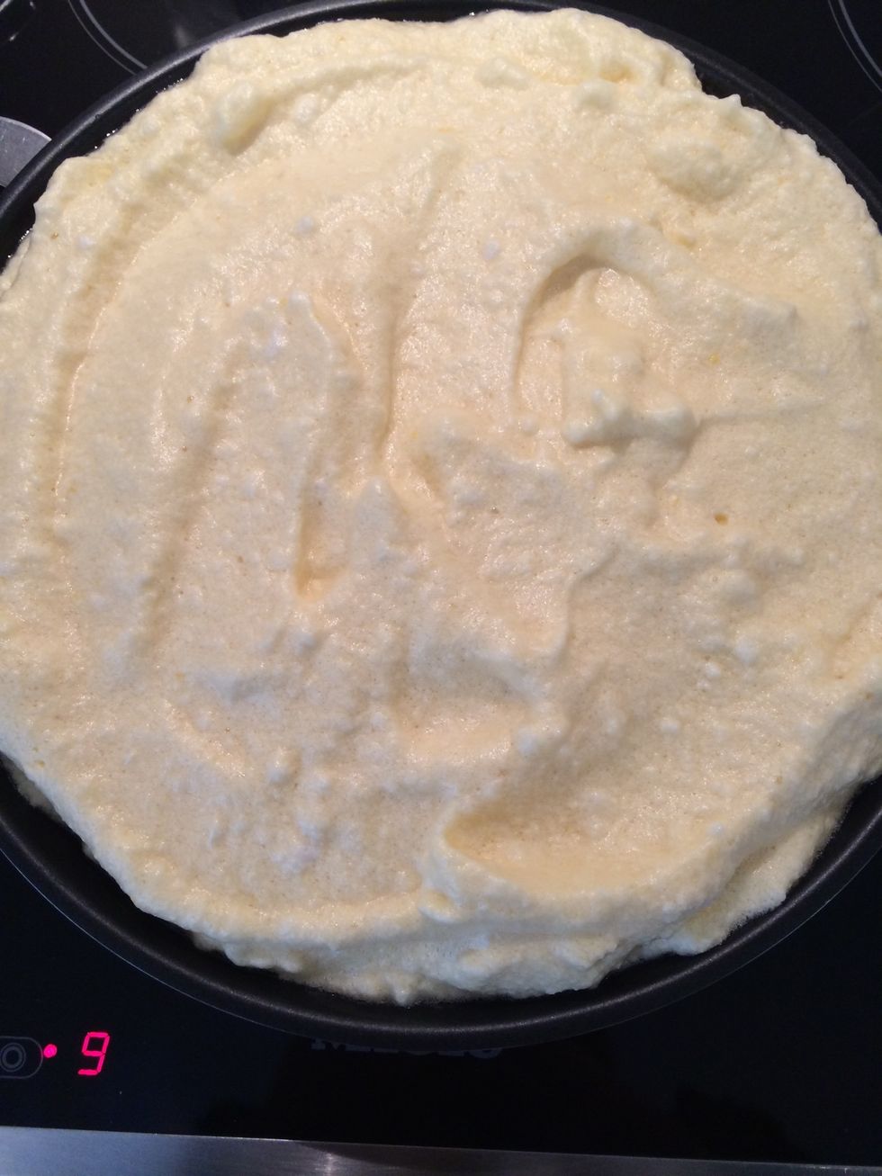 Wipe with butter a non-stick frying pan that can go under the grill. Put the souffl\u00e9 and cook on medium for 2 mins or so..then put under a grill. Cook for 1-2 mins until light golden.